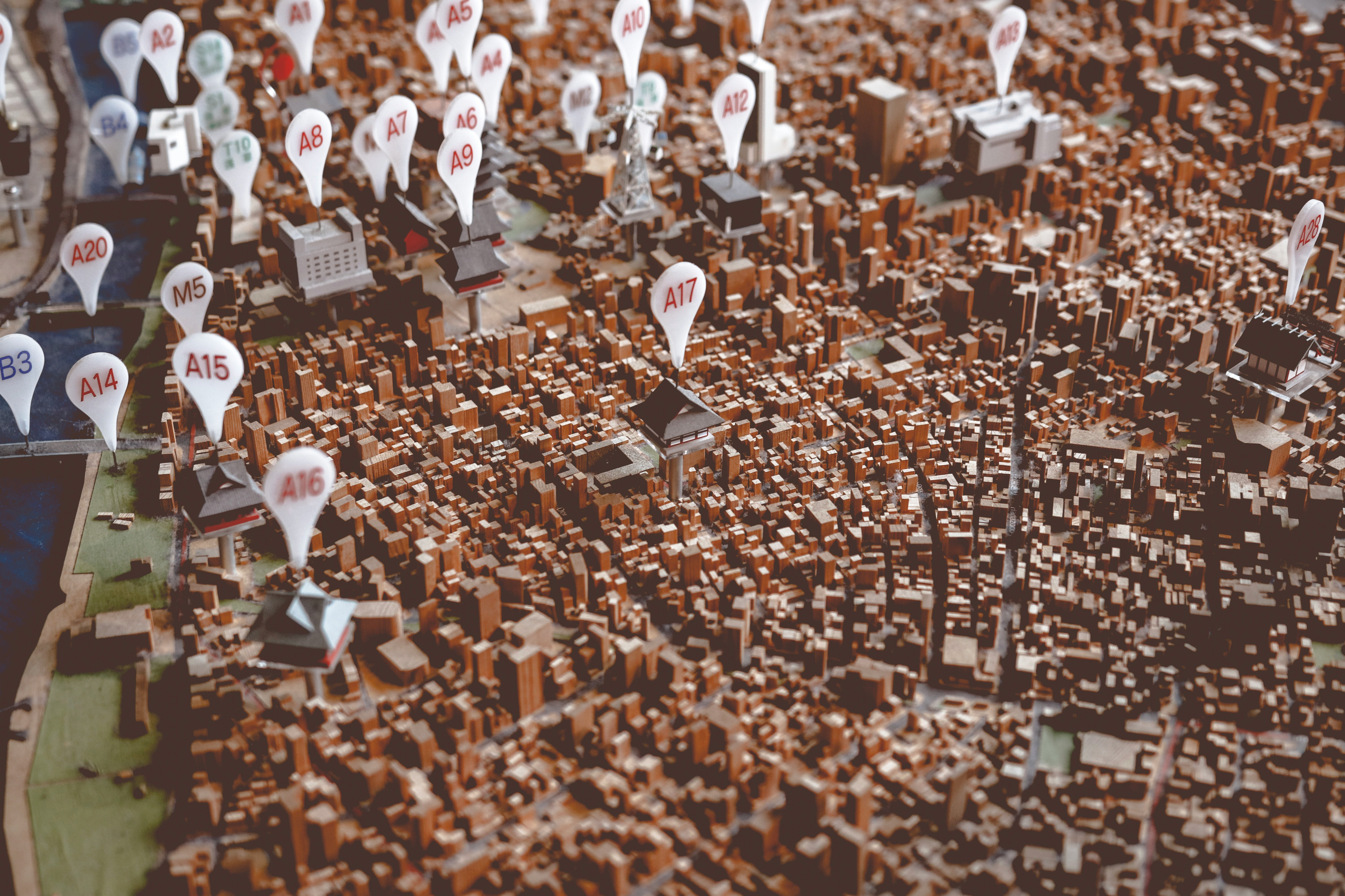 Aerial 3D city map model with numbered location pin markers